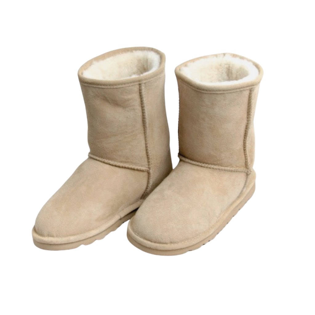 Pair of beige boots with white Australian sheepskin wool fur lining on a white background