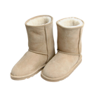 Pair of beige boots with white Australian sheepskin wool fur lining on a white background