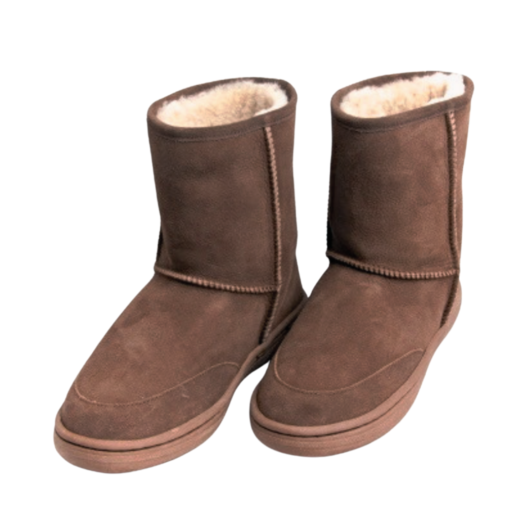 Pair of outdoor brown suede boots with white wool Australian sheepskin fur lining on a white background