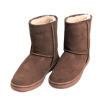 Pair of outdoor brown suede boots with white wool Australian sheepskin fur lining on a white background