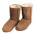 Pair of brown suede boots with white Australian sheepskin wool fur lining on a white background